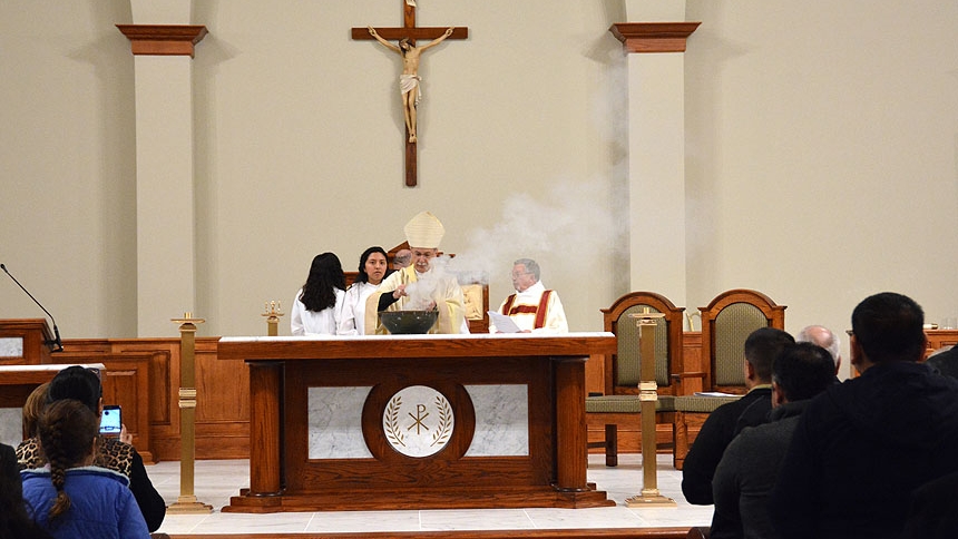 Bishop Luis Rafael Zarama stands at the altar during Mass March 5.