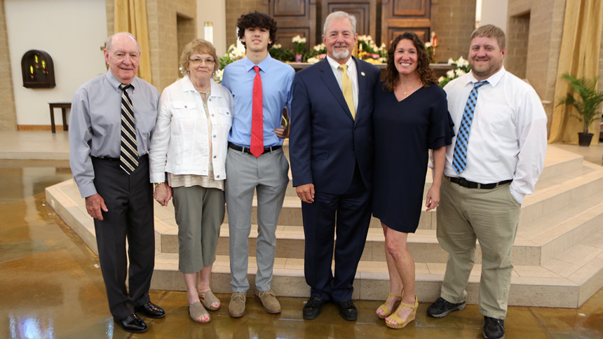 Kelley Champion stands with her family, including her husband Rick, following Mass April 27.