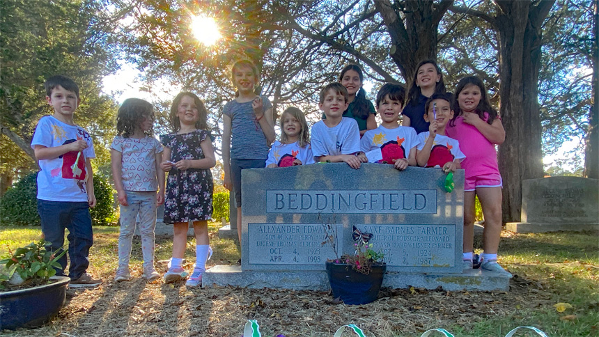 Catholic volunteers pray, clean cemetery for All Souls' Day