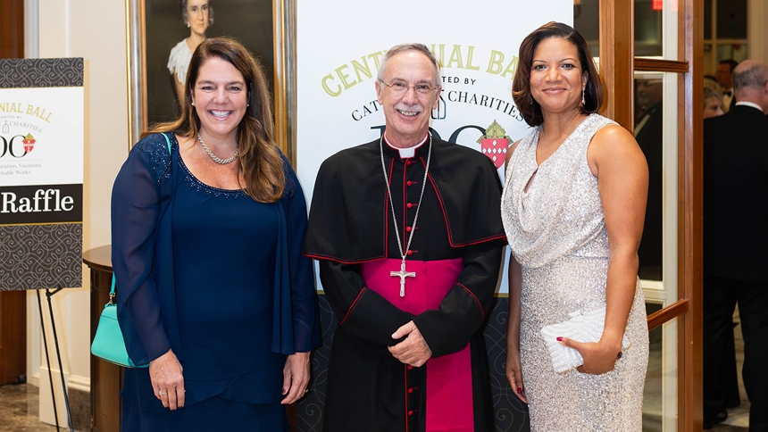 Kerry Alys Robinson, president and CEO of Catholic Charities USA, Bishop Luis Rafael Zarama and Lisa Perkins, chief executive officer of Catholic Charities in the Diocese of Raleigh, gather at the Centennial Ball Nov. 9, 2024.