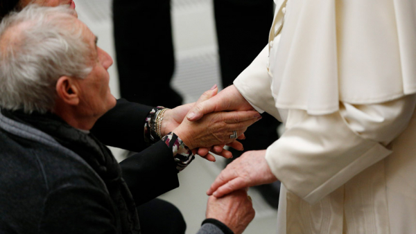 Pope Francis greets people during his general audience in the Paul VI hall at the Vatican Feb. 16, 2022. (CNS photo/Paul Haring)