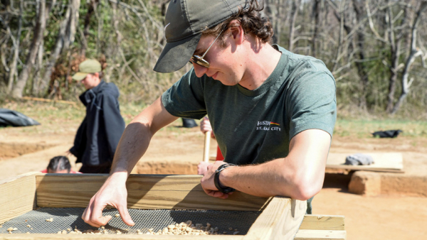 Kyle Vanhoy sifts through rubble March 16, 2022, at the Historic St. Mary's Fort site in southern Maryland. (CNS photo/Zoey Maraist, Catholic Herald)