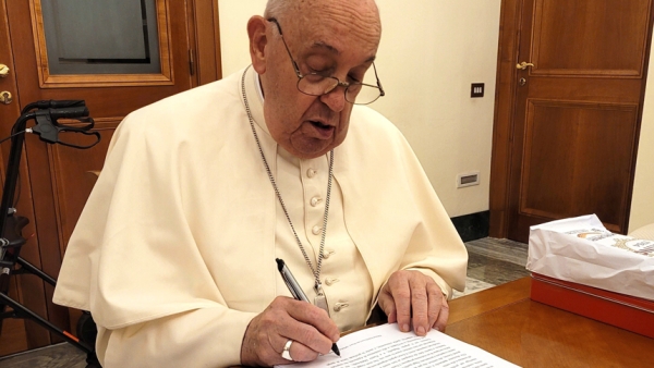 Pope Francis reviews and initials each page of the manuscript of "Hope: The Autobiography" Aug. 9, 2024, in his Vatican residence, the Domus Sanctae Marthae. The book was released in multiple languages Jan. 14, 2025. (CNS photo/courtesy of Mondadori)